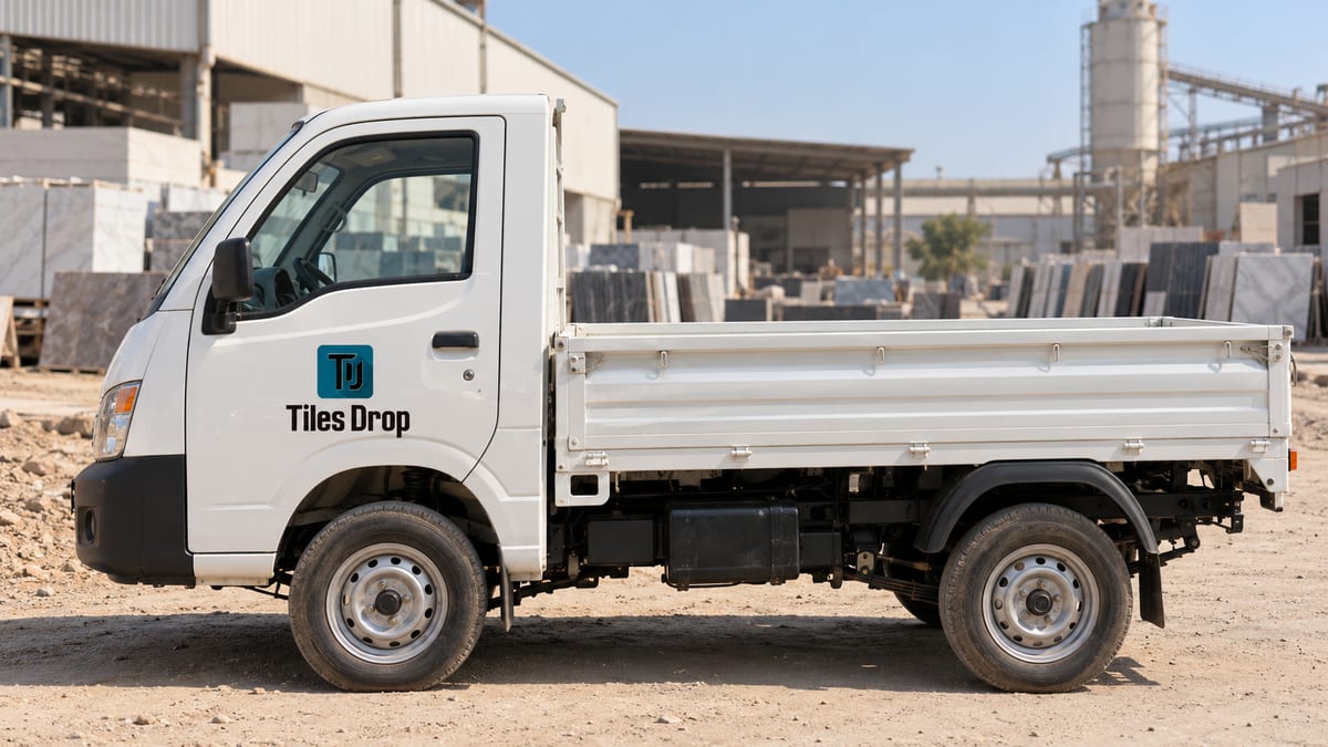 Chhota hathi (Tata Ace) tempo with Tiles Drop logo at a Morbi tiles factory